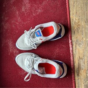 Nike Kids White Sneakers with Blue and Orange Accents
